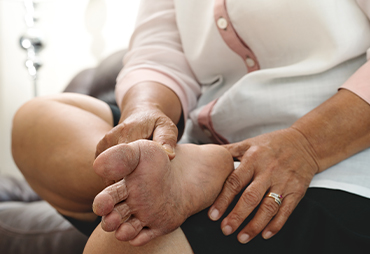 Diabetic taking care of her feet