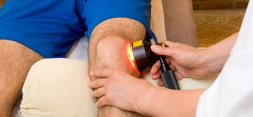 Patient receiving Cold laser therapy as part of her neuropathy treatment protocol